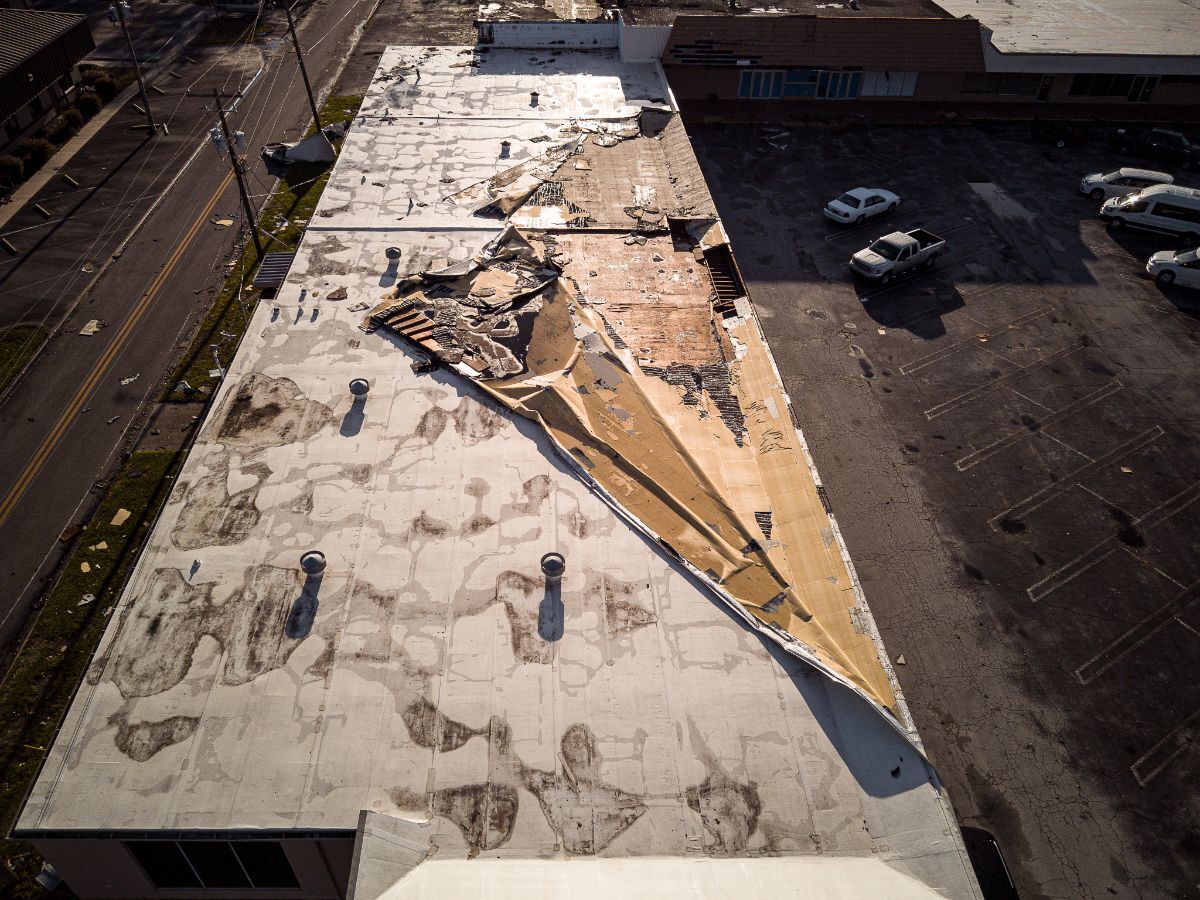 Aerial view of storm-damaged metal roof