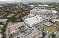 Aerial view of urban Coral Springs: Commercial flat roofing complex.