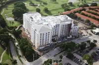 Aerial view of commercial roof installation on multi-story building, Coral Springs, FL