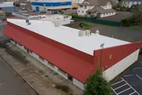 Aerial view of commercial flat roof with TPO membrane in Portland, OR