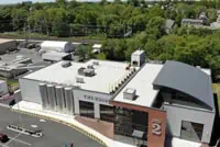 Aerial view of curved roof fire station in West Haven, CT.