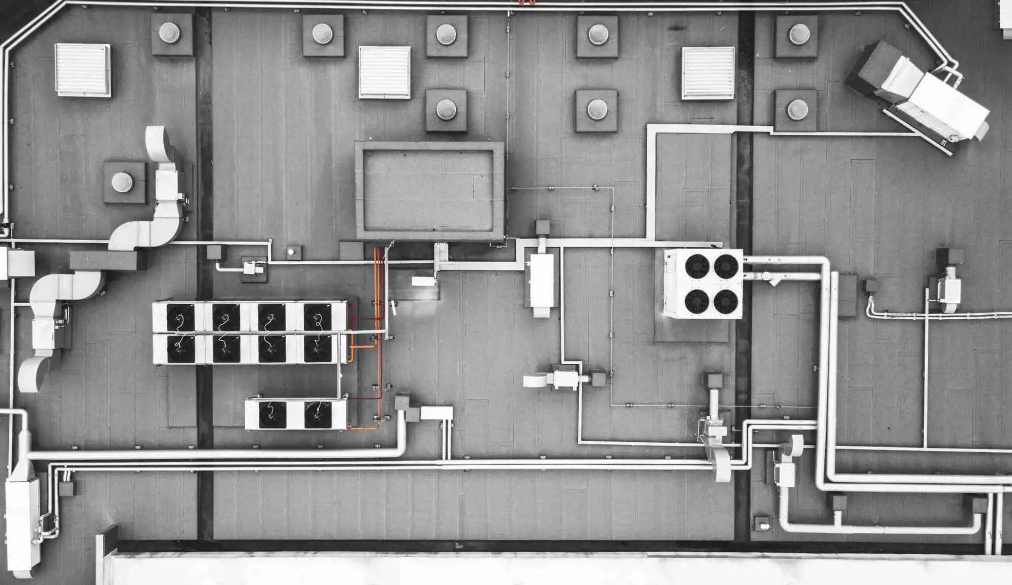 Aerial view: Commercial rooftop ventilation units and ducts, highlighting efficient roof ventilation.