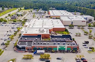 Aerial view of commercial flat roofs in Mobile, AL shopping center