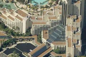 Aerial view of Marriott resort with red roofs and glass atrium in Orlando.