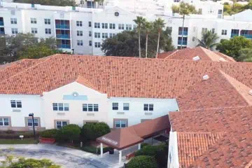 Aerial view of Stratfort Court - Red-tiled commercial roof surrounded by greenery