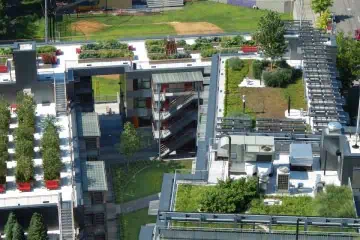 Aerial view of Via Verde rooftop with green spaces and utility structures