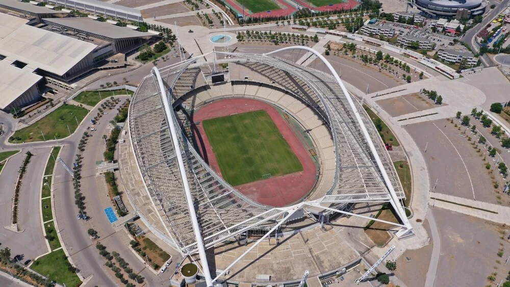 Bird’s eye view of a stadium with transparent panels and an open roof.