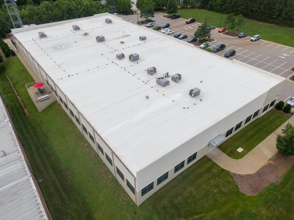 White single-ply roofing system installed on a commercial building.