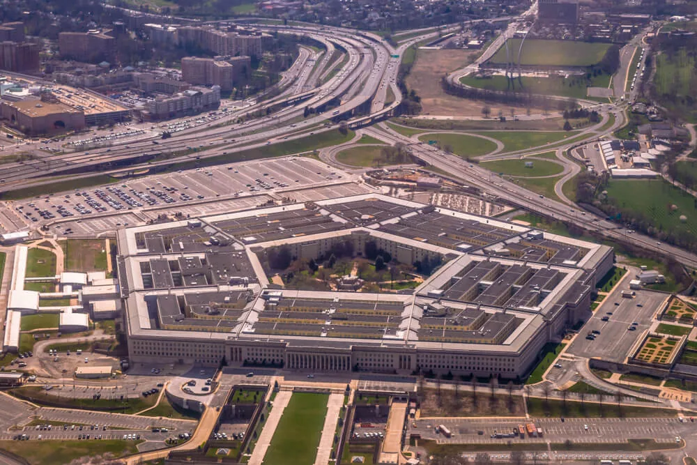 Aerial view of the Pentagon showcasing its flat roof design, including EPDM and TPO roofing elements with nearby highways.