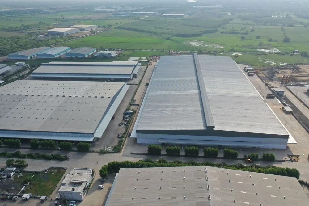 Several commercial buildings with heavy-duty metal roofs.